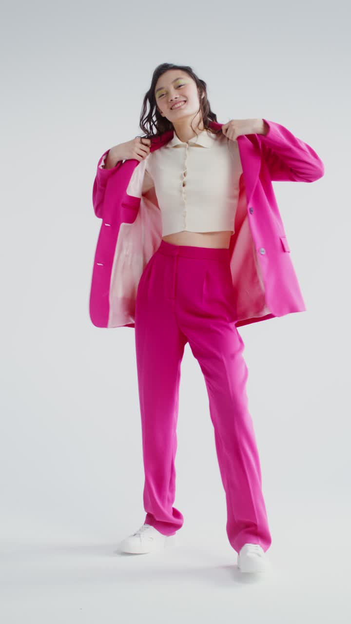 Woman in Pink Suit Posing