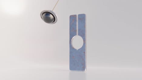 forma geométrica de metal oxidado con péndulo