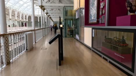 visitors walking through museum exhibits