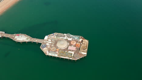 high circling aerial shot over brighton pier