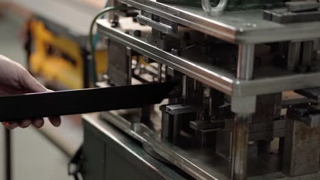 hands of a man using iron drilling machines, for drilling aluminum bars