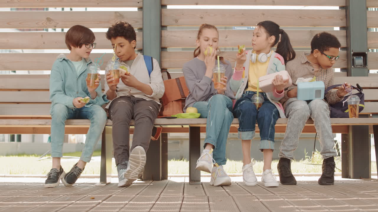 School Kids Having Lunch Outdoors