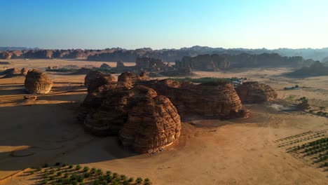 beautiful drone shot alula desert in saudi arabia with rocks and sun