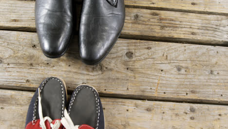 Pairs-of-new-shoes-on-wooden-plank