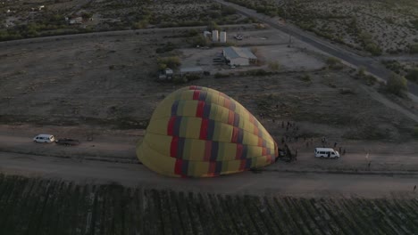 drone flying around hot air balloon while it inflates_02