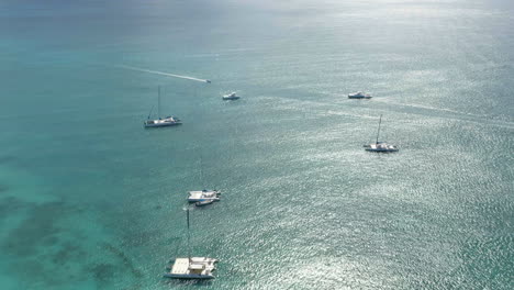 Luxurious-catamaran-yachts-in-tropical-Caribbean-waters,-Saona-island