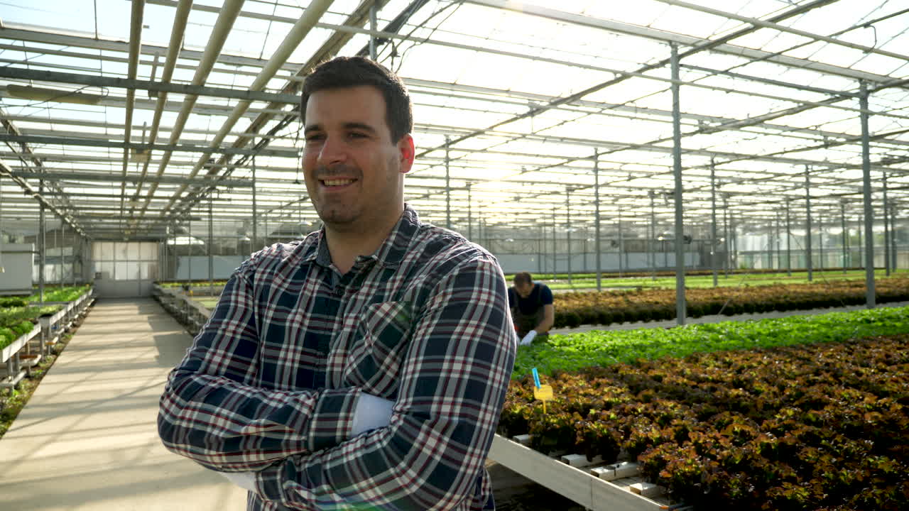 Man in Greenhouse with Crops