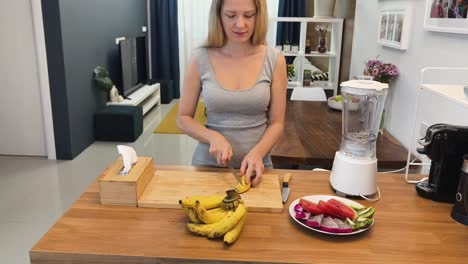 woman preparing a smoothie