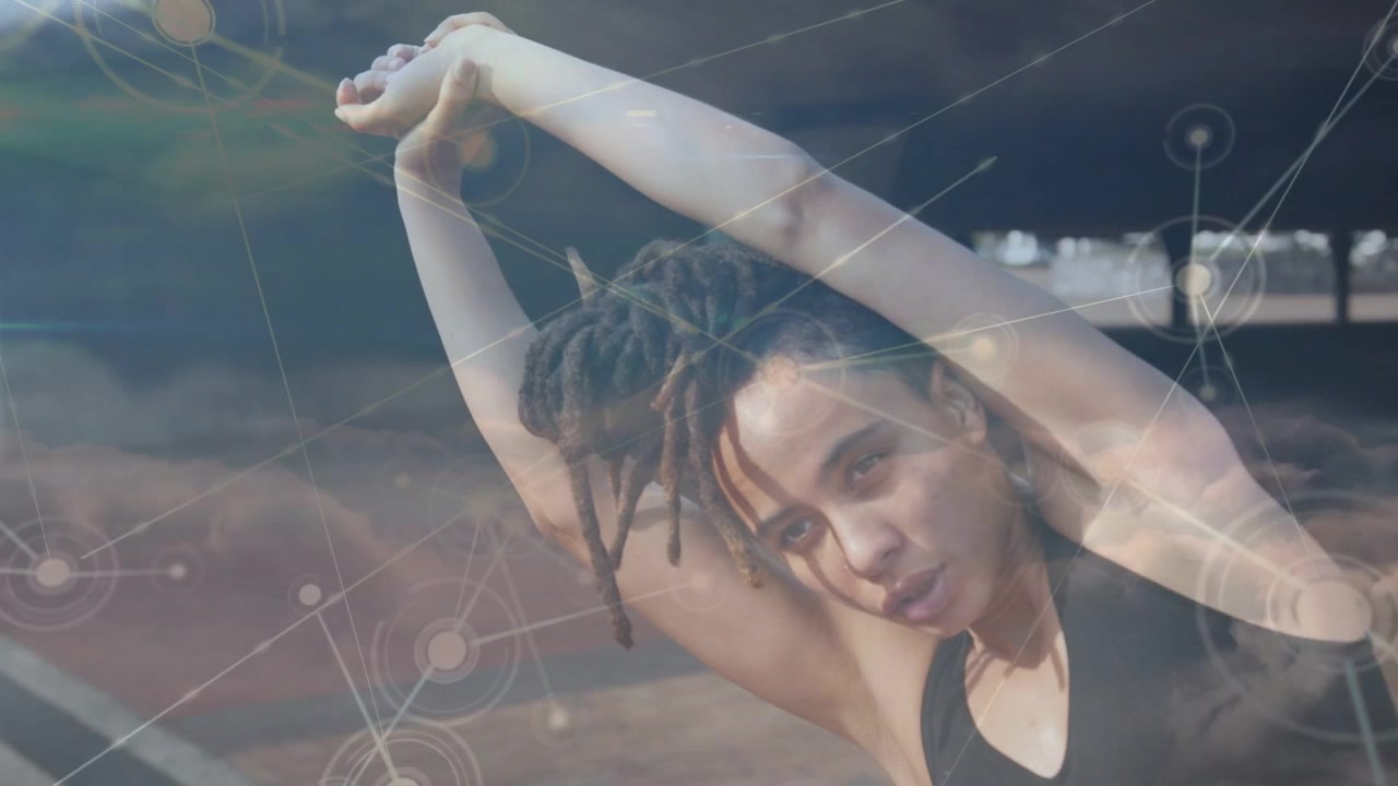 Woman initiating overhead stretch by lifting arms, warming for health under shelter, HUD growing