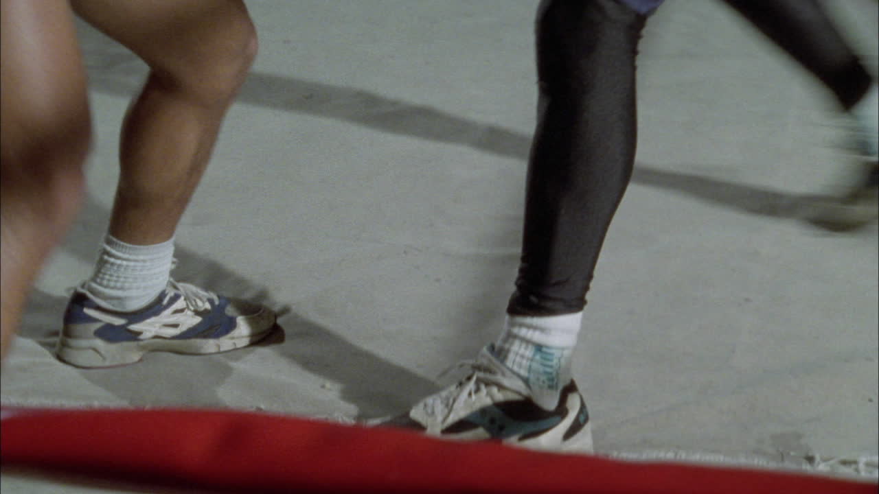 Two boxers spare in a boxing ring