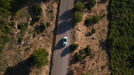 Modern-car-road-trip-driving-along-a-street