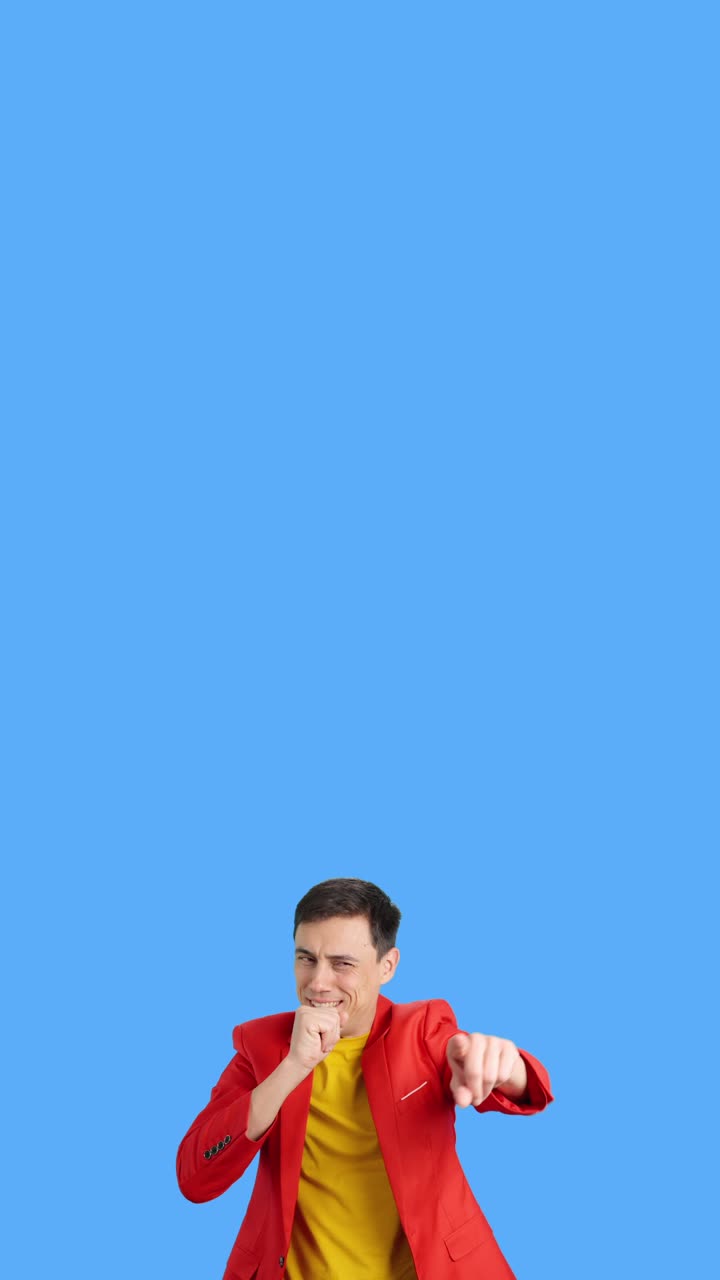 Man in Red Jacket on Blue Background