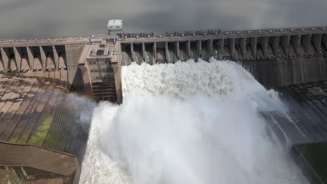 aerial retreats downstream from power dam releasing reservoir water