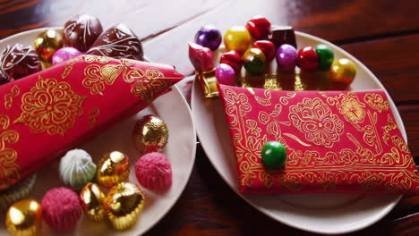 assorted chocolates and festive red envelopes