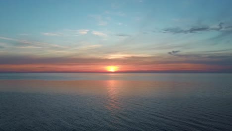 dron flying over sea in a beautiful sunset