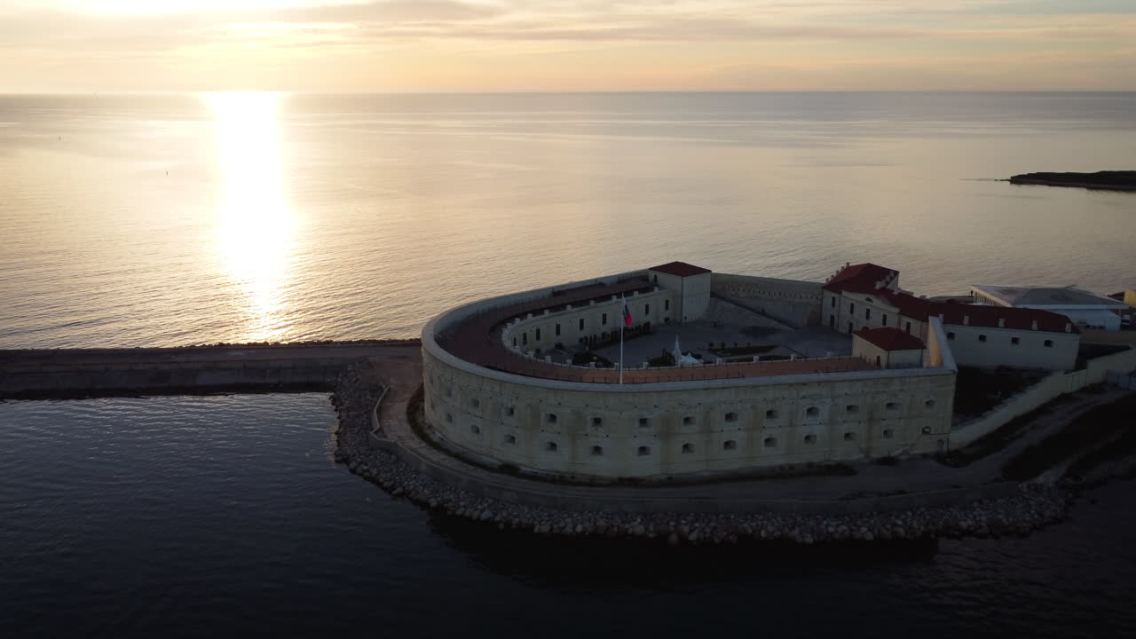 Aerial View of a Fortress at Sunrise/Sunset over the Sea