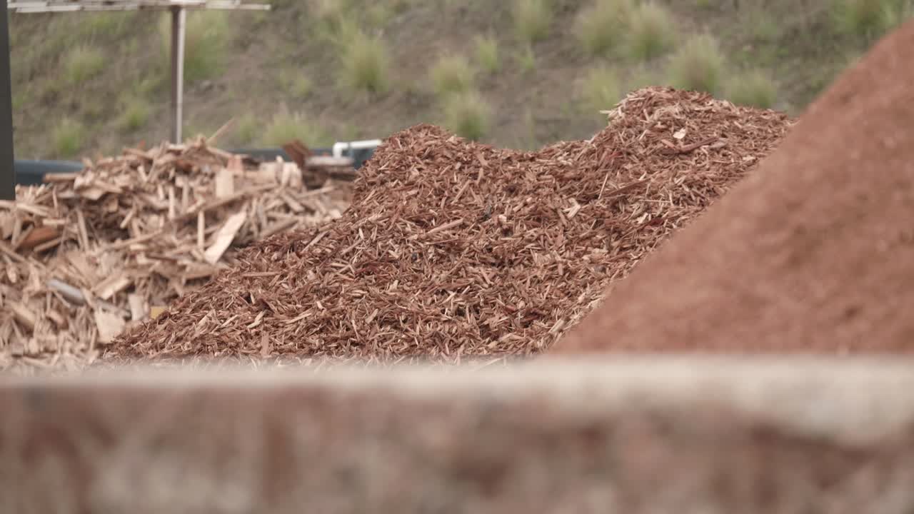 Piles of wood, wood chip and sawdust, prepared recycled wood from construction industry