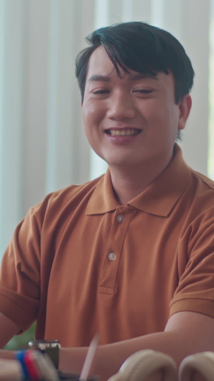 Portrait of Positive Asian Employee at Office