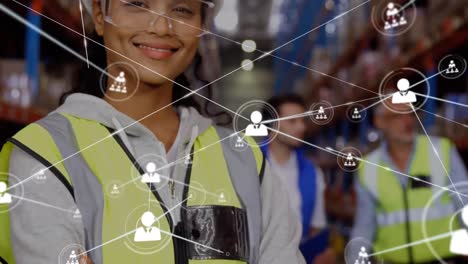 Animation-of-network-of-profile-icons-over-biracial-female-supervisors-smiling-at-warehouse
