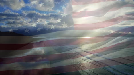 animation of flag of usa blowing over beach landscape