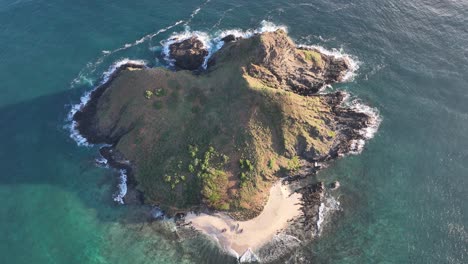 aerial-drone-panning-footage-of-mokulua-island-in-lanikai-hawaii-beautifl-sunrise-beach-and-deep-blue-ocean