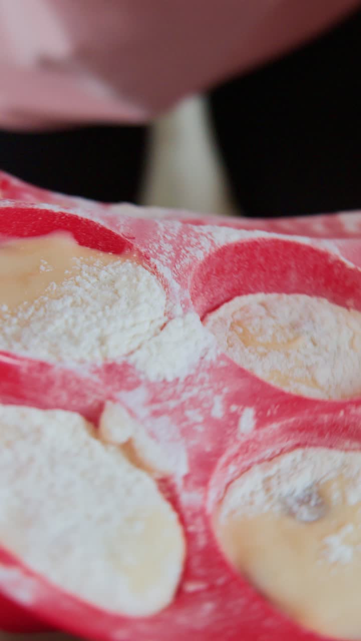 Baking Process: Hands Preparing Batter in Silicone Molds Followed by a Close-Up of the Molds in the Oven for Perfectly Baked Treats