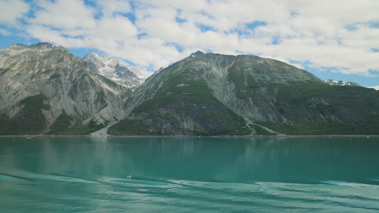 Beautiful mountains in Glacier Bay, Alaska seen from a moving ship. For projects requiring longer clips in higher resolution, visit StockPlates.