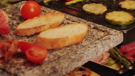 french swiss or spanish restaurant with traditional tapas food, spanish cuisine, delicious tapas and cheese plate, bruschetta with cheese, olives dry tomatoes and tasty sandwich bar appetizer, buffet