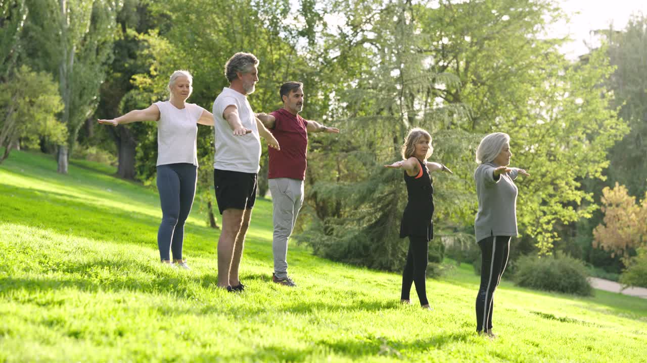 Group of people exercising in a park