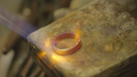 italian goldsmith at work building an engagement or a wedding ring