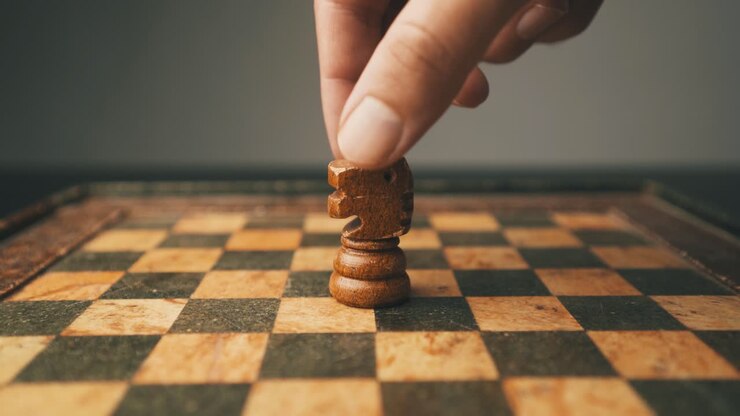 White knight chess piece on the board