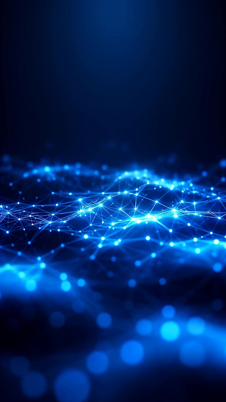 Low angle view of glowing blue network mesh with pulsing nodes, shifting focus, and undulating wave forms, bright linked points and luminous lines create dynamic futuristic depth and energy