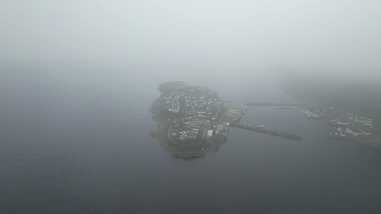 Aerlia shot of Husøy on Senja in Norway out of clouds | Dji Air2s