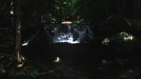 Looking-at-the-waterfall-in-Thailand.