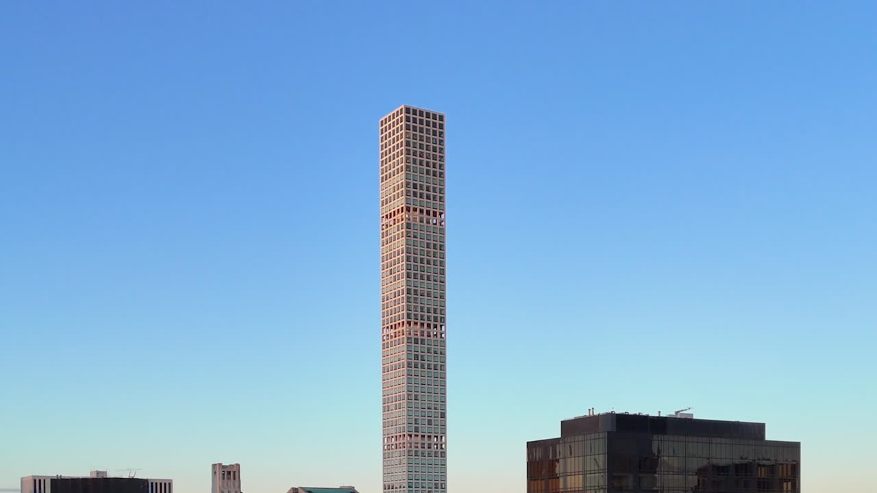 Aerial view rising toward the 432 Park Avenue skyscraper, sunset in New York, USA