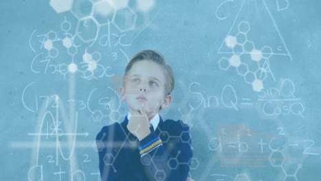 animation of dna strand diagrams and data processing over caucasian schoolboy at chalkboard