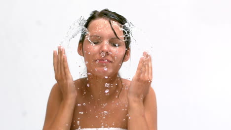 Woman-splashing-water-on-her-face