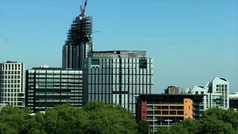 Apache-AH-64-helicopter-lands-with-precision-between-city-buildings-into-the-Honourable-Artillery-Company-an-inner-city-London-army-base-and-onto-a-football-field