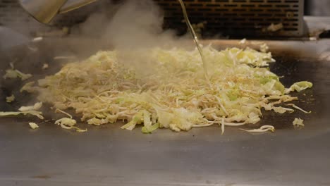 cooking teppanyaki cabbage and bean sprouts
