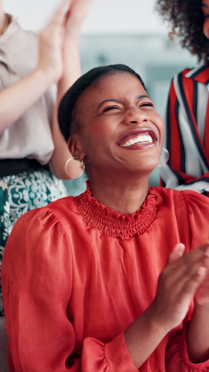Happy Black Woman Laughing and Clapping with Colleagues