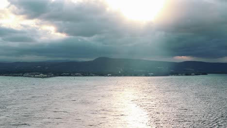 time lapse view departing kingston, jamaica at sunset on a cloudy summer evening