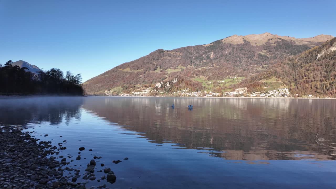 Walensee lake Walen calm water surface alpine Swiss mountains landscape Europe