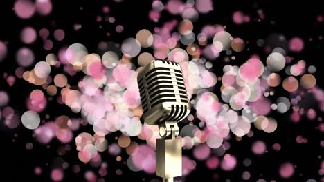 Animation-of-microphone-over-pink-spots-of-light-against-black-background-with-copy-space