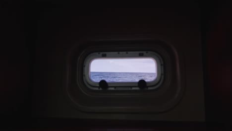 seascape view from cabin porthole window during navigation