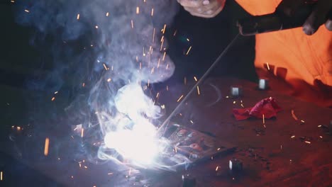 metal welder working with arc welding machine