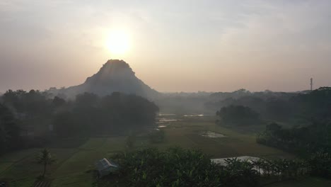 sunrise over rice paddies and mountains