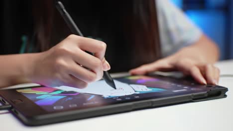 Artist Skillfully Illustrates on a Tablet, Capturing Detailed Artwork with a Stylus While Engaged in Digital Creation at a Well-Lit Workspace