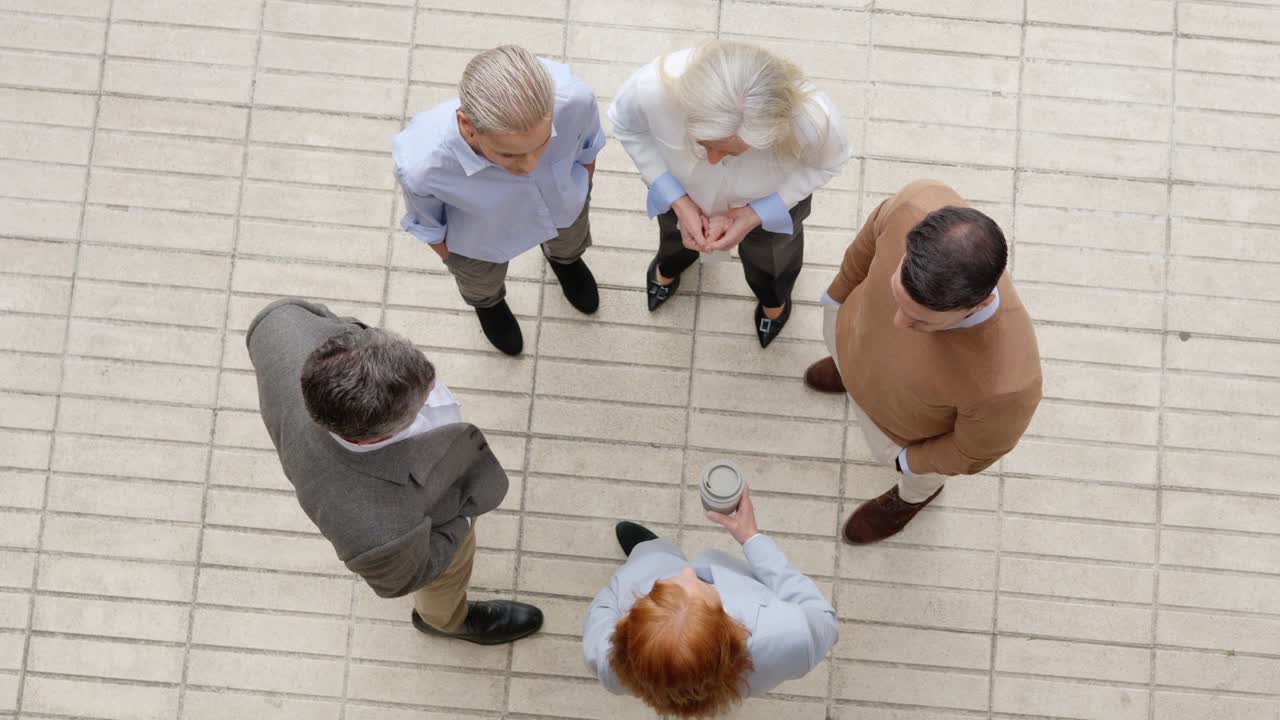 Overhead view of business professionals in a discussion circle