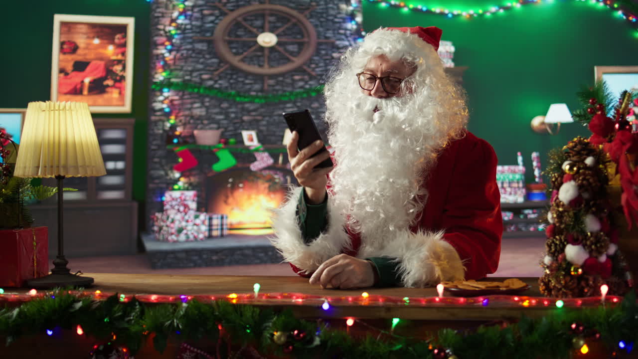 Santa Claus Using Smartphone at Christmas