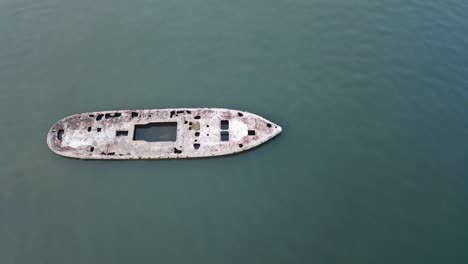 top view of an old sunken ship during a low tide